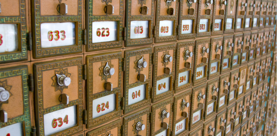 Private brass mailboxes arranged inside the Folsom location